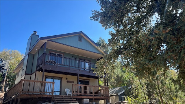 rear view of house with a balcony