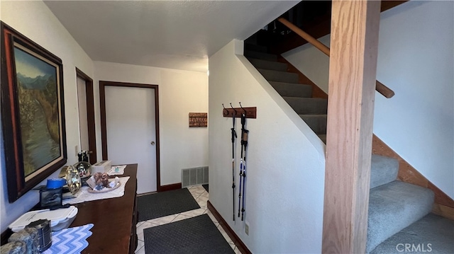 hallway with light tile patterned floors