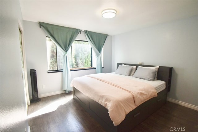 bedroom featuring dark hardwood / wood-style floors