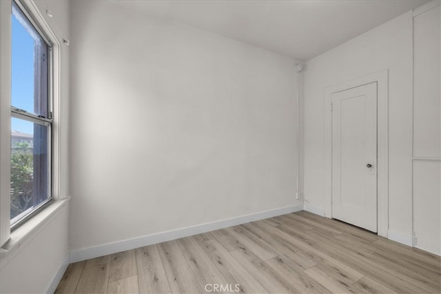 spare room featuring light wood-type flooring