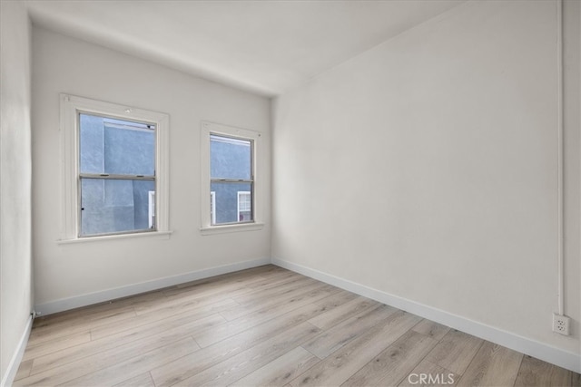 unfurnished room featuring light wood-type flooring