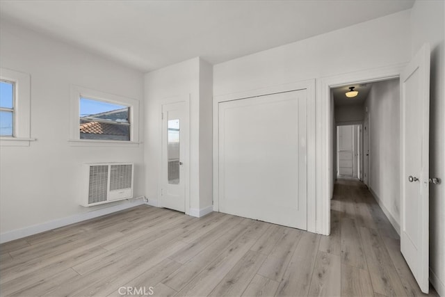 interior space featuring heating unit and light hardwood / wood-style flooring