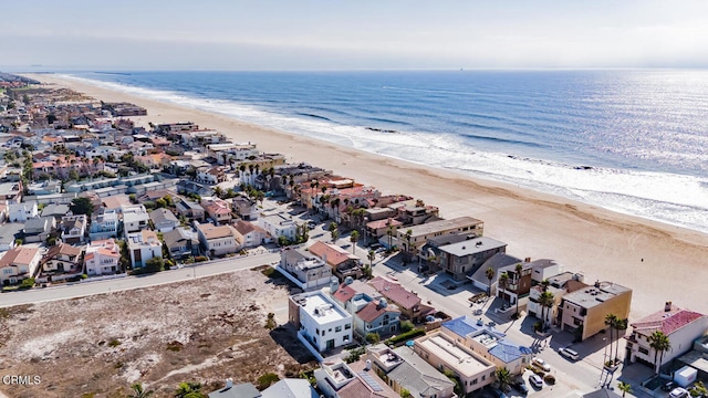 bird's eye view with a water view and a view of the beach