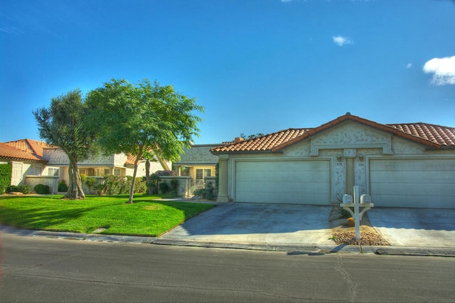 view of front of property with a garage and a front yard