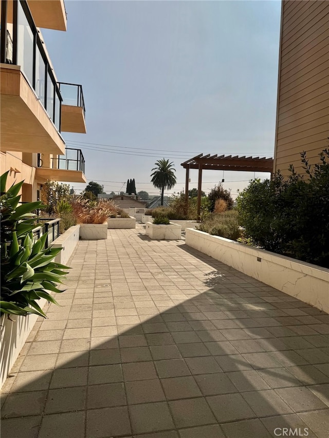 view of patio / terrace with a balcony