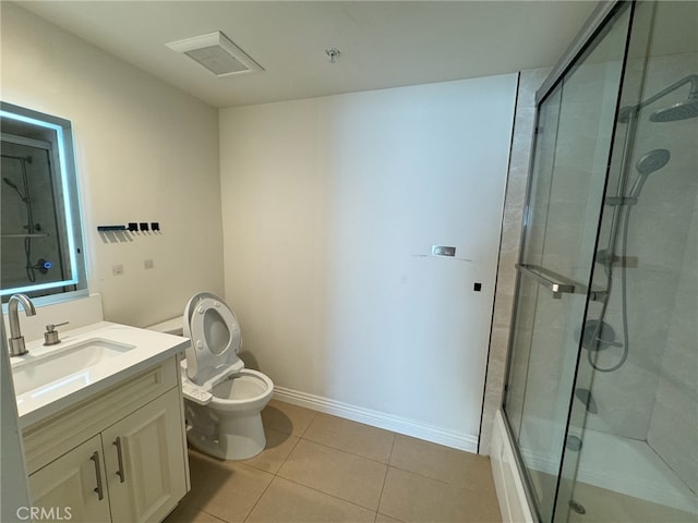 bathroom featuring tile patterned flooring, an enclosed shower, vanity, and toilet