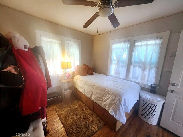 bedroom featuring ceiling fan and wood-type flooring