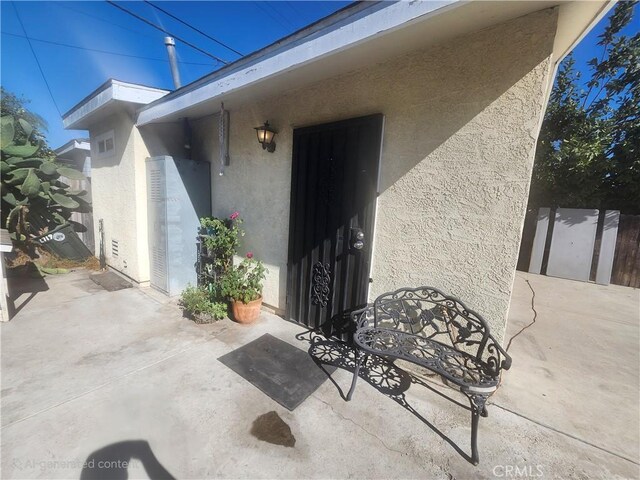 entrance to property with a patio area