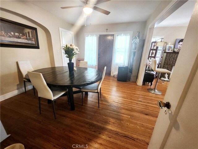 dining room with ceiling fan and wood-type flooring