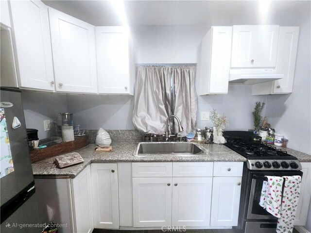 kitchen featuring white cabinets, stainless steel range with gas stovetop, and sink