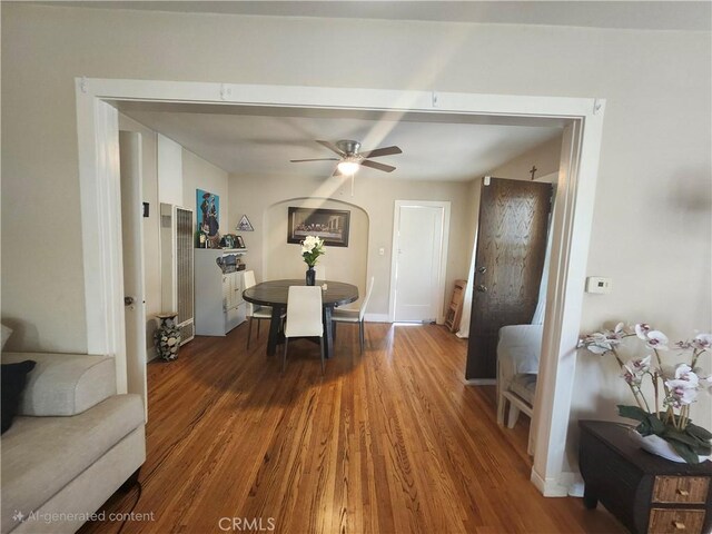 dining space featuring hardwood / wood-style floors and ceiling fan