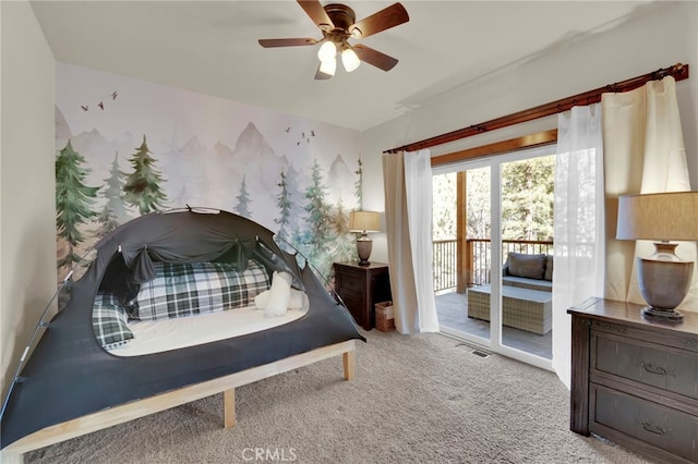 bedroom featuring access to exterior, light colored carpet, and ceiling fan