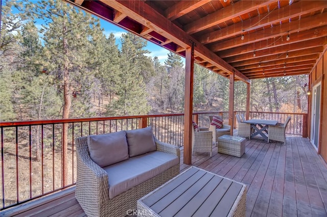 wooden terrace featuring an outdoor living space