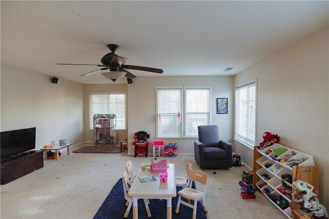 playroom with carpet flooring and ceiling fan