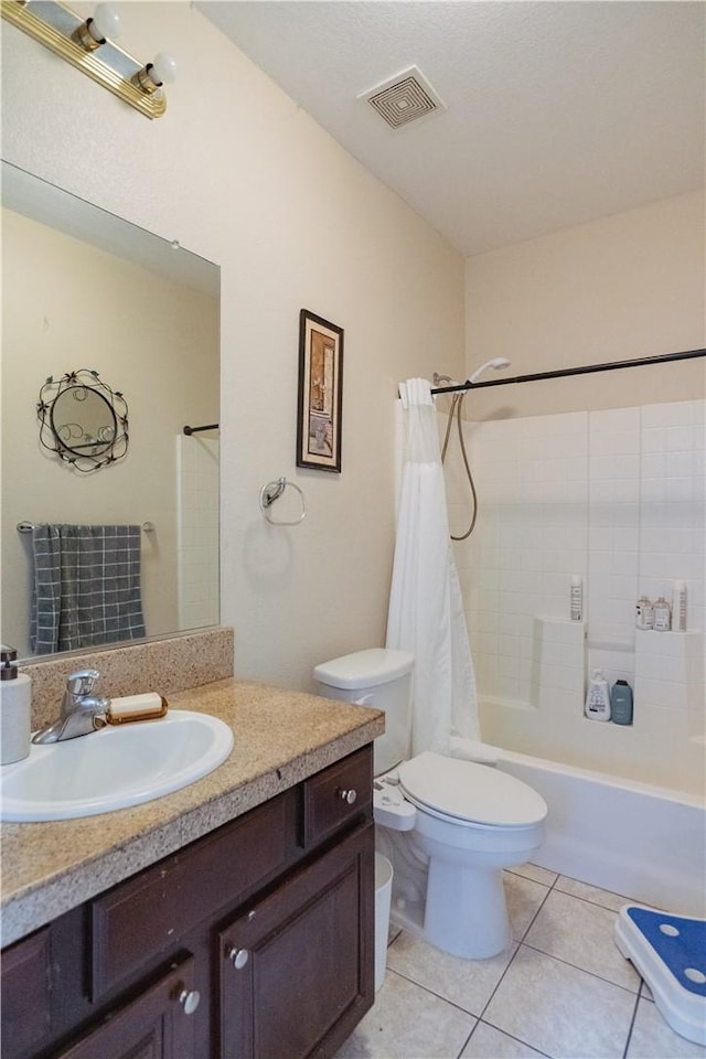 full bathroom featuring tile patterned floors, shower / tub combo with curtain, vanity, and toilet