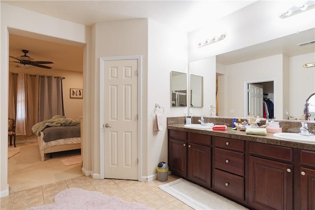 bathroom with tile patterned floors, ceiling fan, and vanity