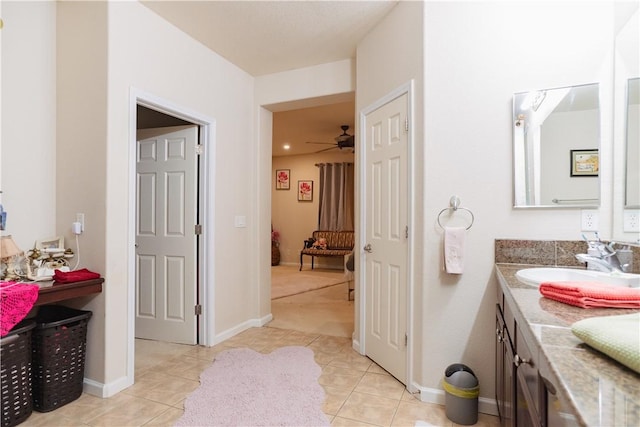 bathroom featuring tile patterned floors, vanity, and ceiling fan