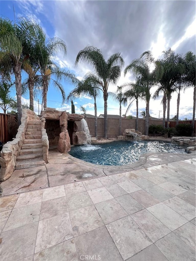 view of pool featuring pool water feature