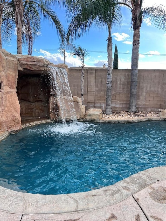 view of pool featuring pool water feature