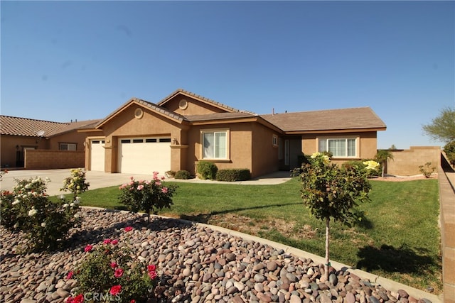 ranch-style house featuring a front lawn and a garage