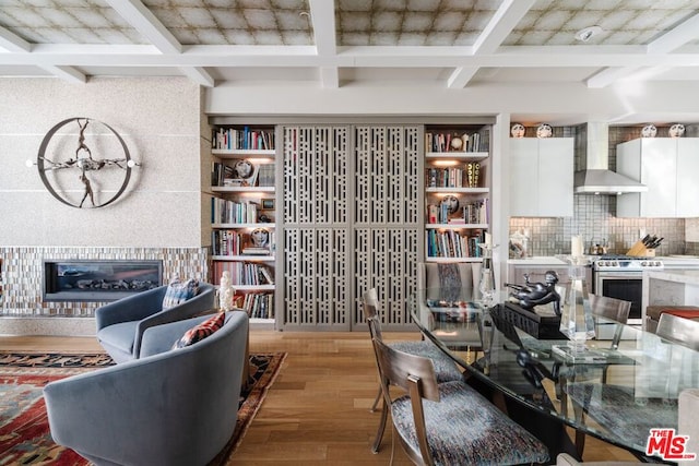 interior space featuring beamed ceiling and hardwood / wood-style floors