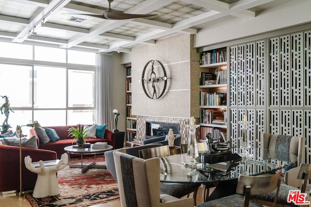 dining area featuring beamed ceiling and coffered ceiling