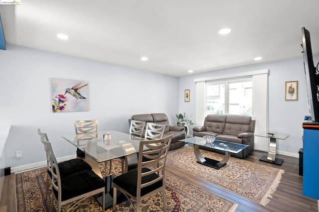 dining area with dark hardwood / wood-style floors