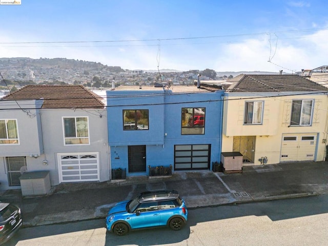 view of front of home featuring a mountain view and a garage