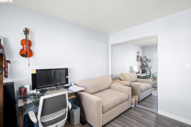 home office with dark hardwood / wood-style flooring