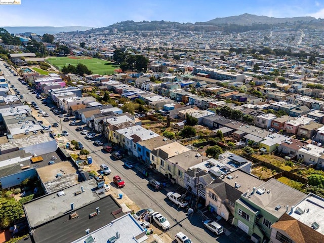 birds eye view of property with a mountain view