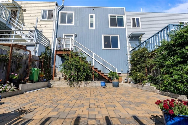 rear view of house featuring a patio