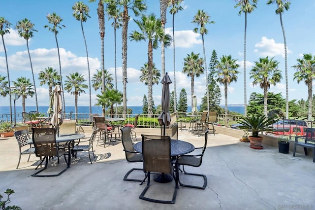 view of patio with a water view