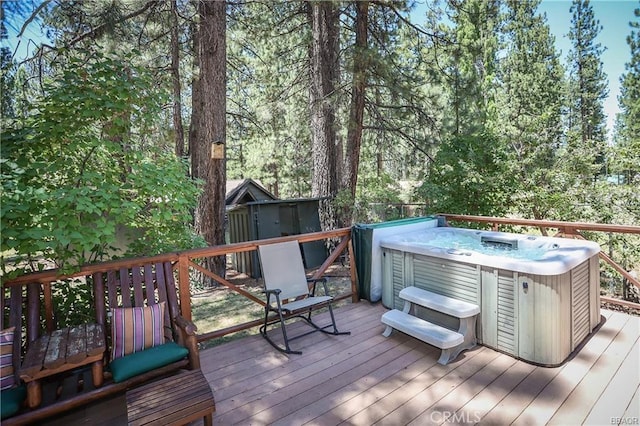 wooden deck with a hot tub