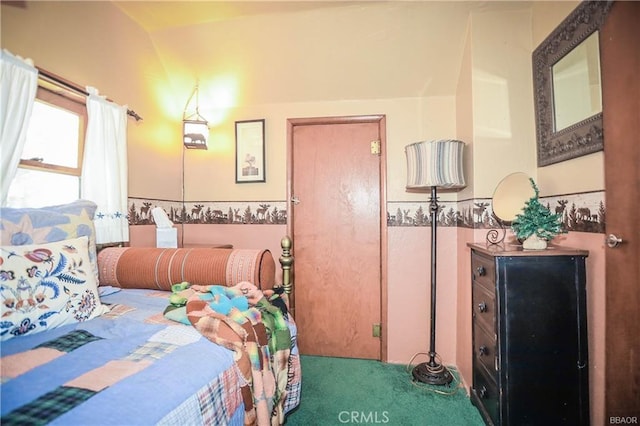 bedroom with carpet and lofted ceiling