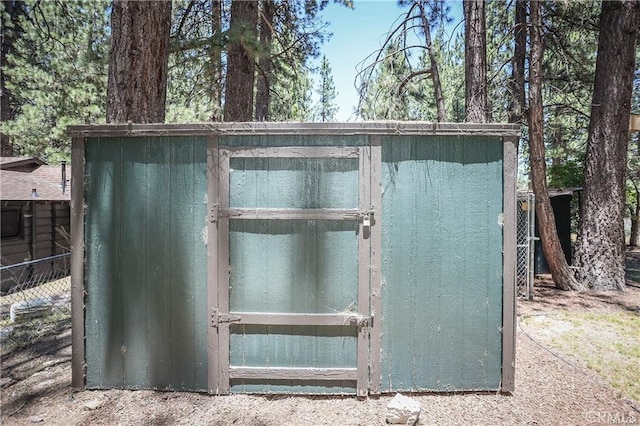 view of storm shelter with a storage shed