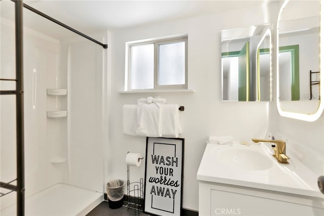 bathroom with vanity and walk in shower