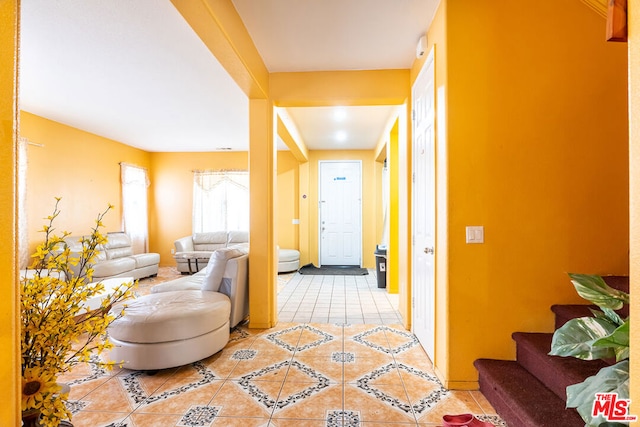 hallway with light tile patterned floors