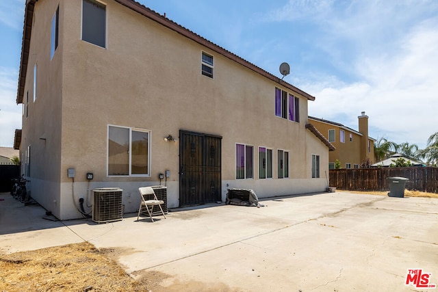 back of house featuring a patio area and central AC