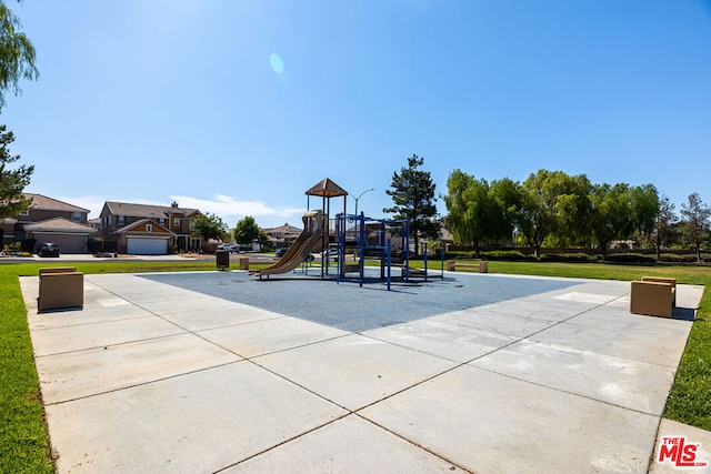 view of playground featuring a lawn