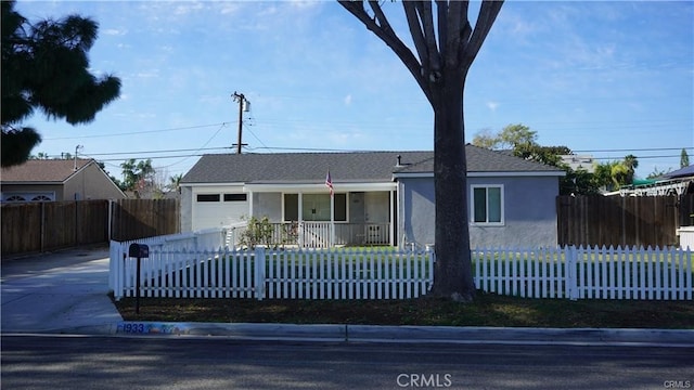 view of front of property featuring a porch and a garage