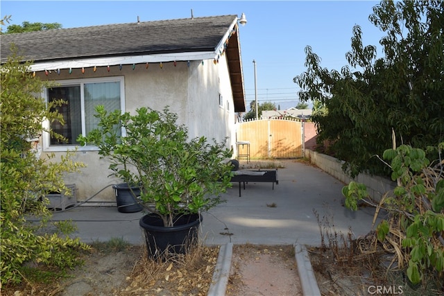 view of property exterior featuring a patio area