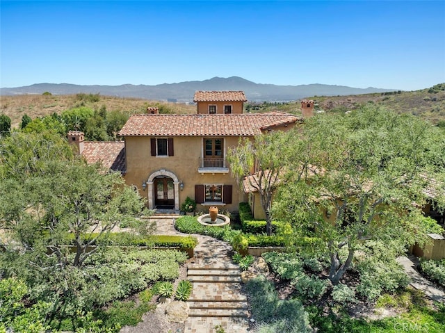 mediterranean / spanish-style home with a mountain view