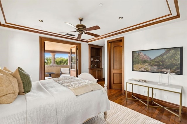 bedroom featuring ornamental molding, dark wood-type flooring, and ceiling fan