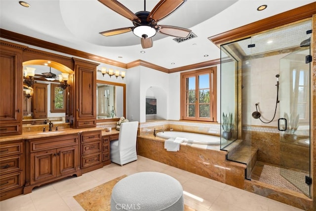 bathroom featuring vanity, shower with separate bathtub, ornamental molding, and tile patterned floors