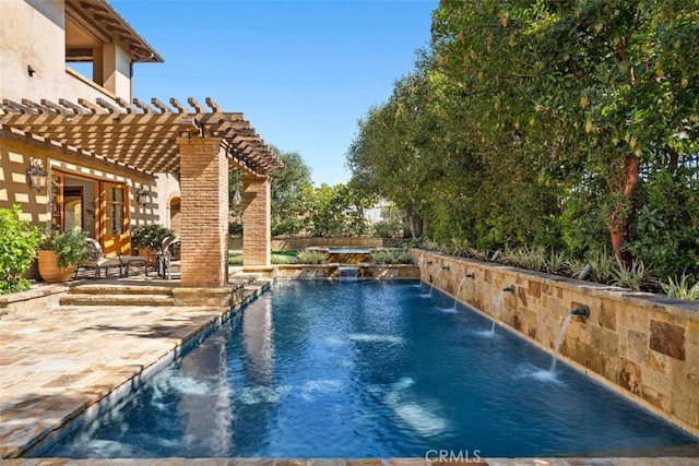 view of pool featuring a patio, a jacuzzi, pool water feature, and a pergola