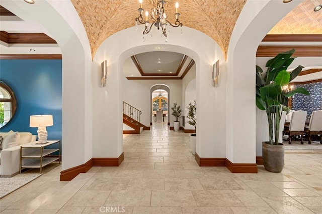 interior space with crown molding and a notable chandelier