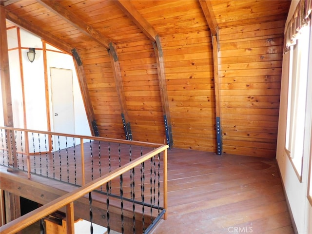 corridor featuring hardwood / wood-style flooring, lofted ceiling with beams, and wooden ceiling