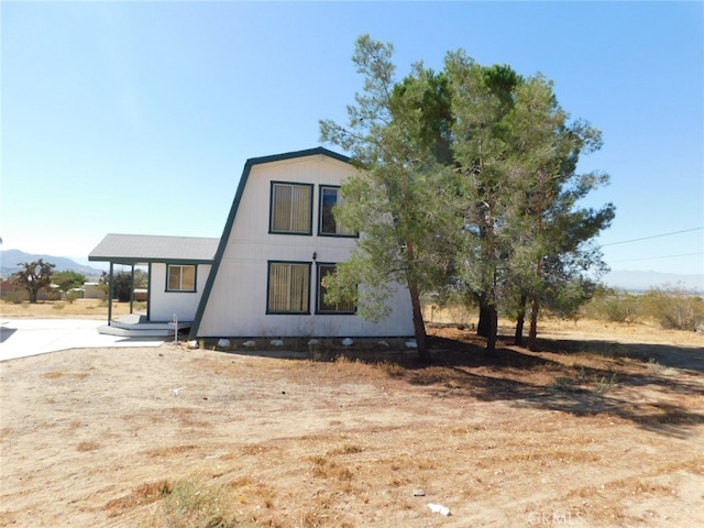 view of side of property featuring a mountain view