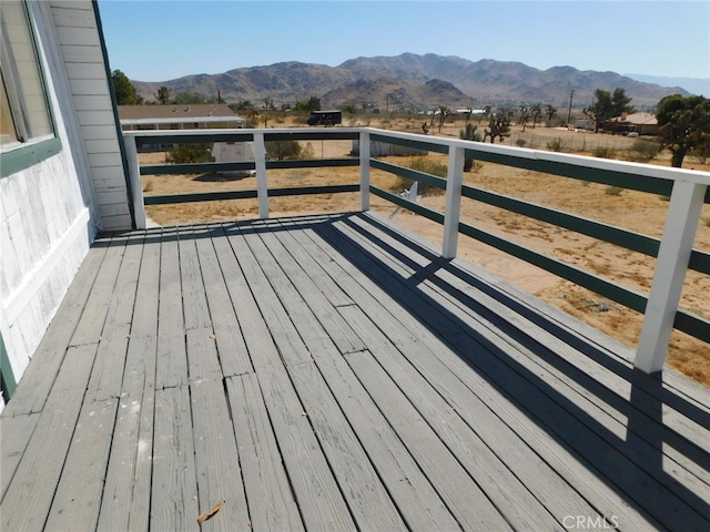 wooden terrace featuring a mountain view