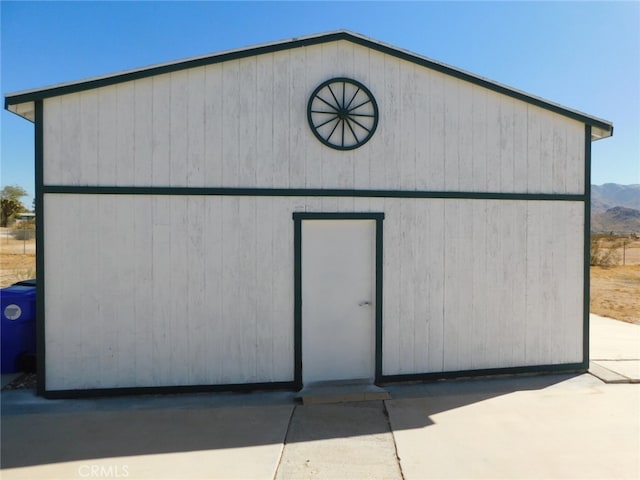 view of outbuilding with a mountain view